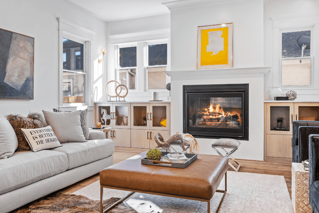 Bright professionally photographed living room with a fireplace
