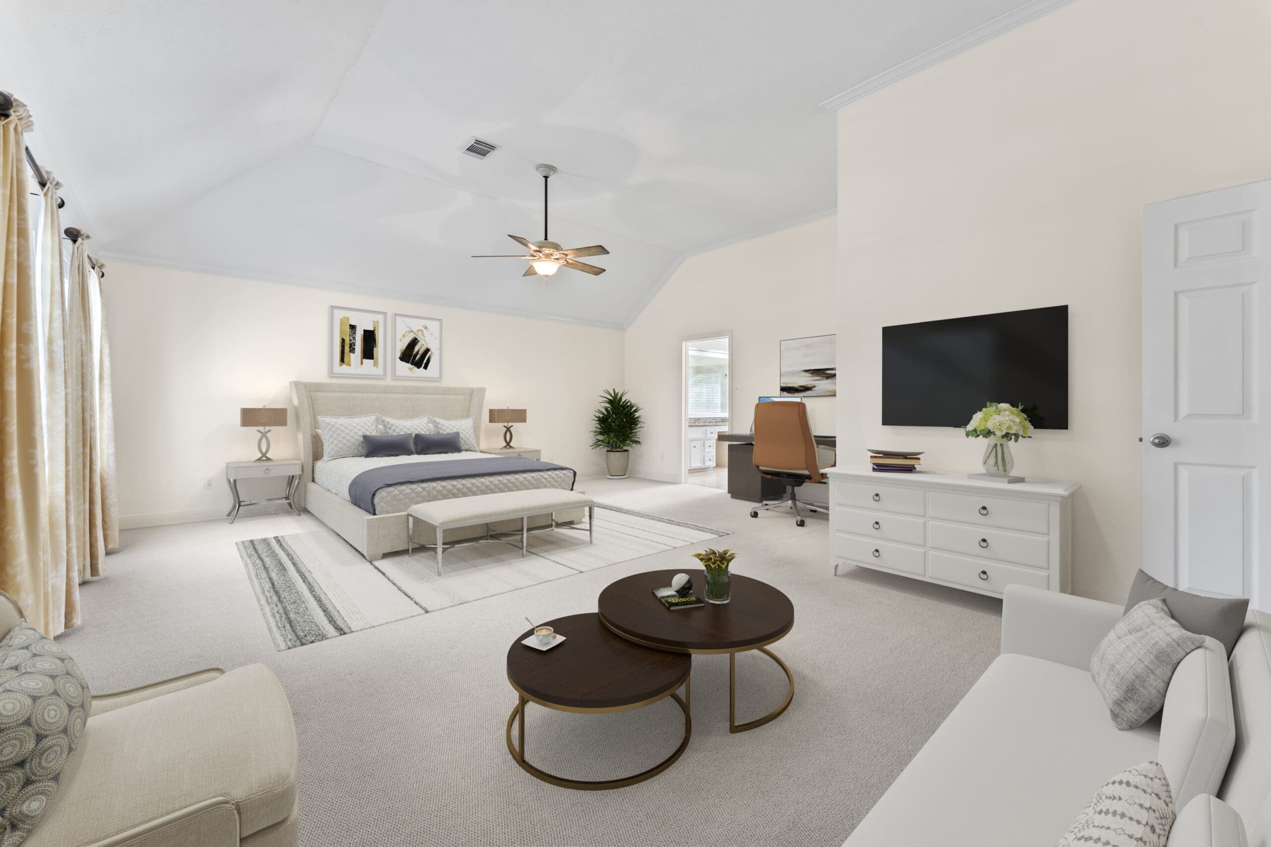 Virtually staged primary bedroom with modern furnishings and a home office.