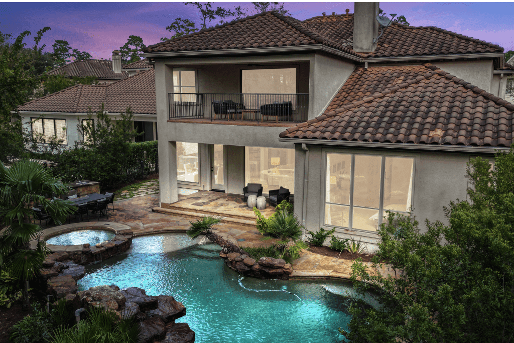 HDR twilight real estate photograph showing a home's exterior lighting and evening sky.