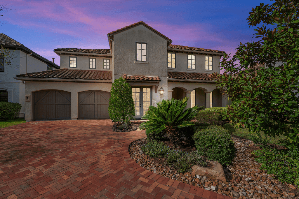 Virtual twilight HDR photograph highlighting a residential exterior and landscaped yard.