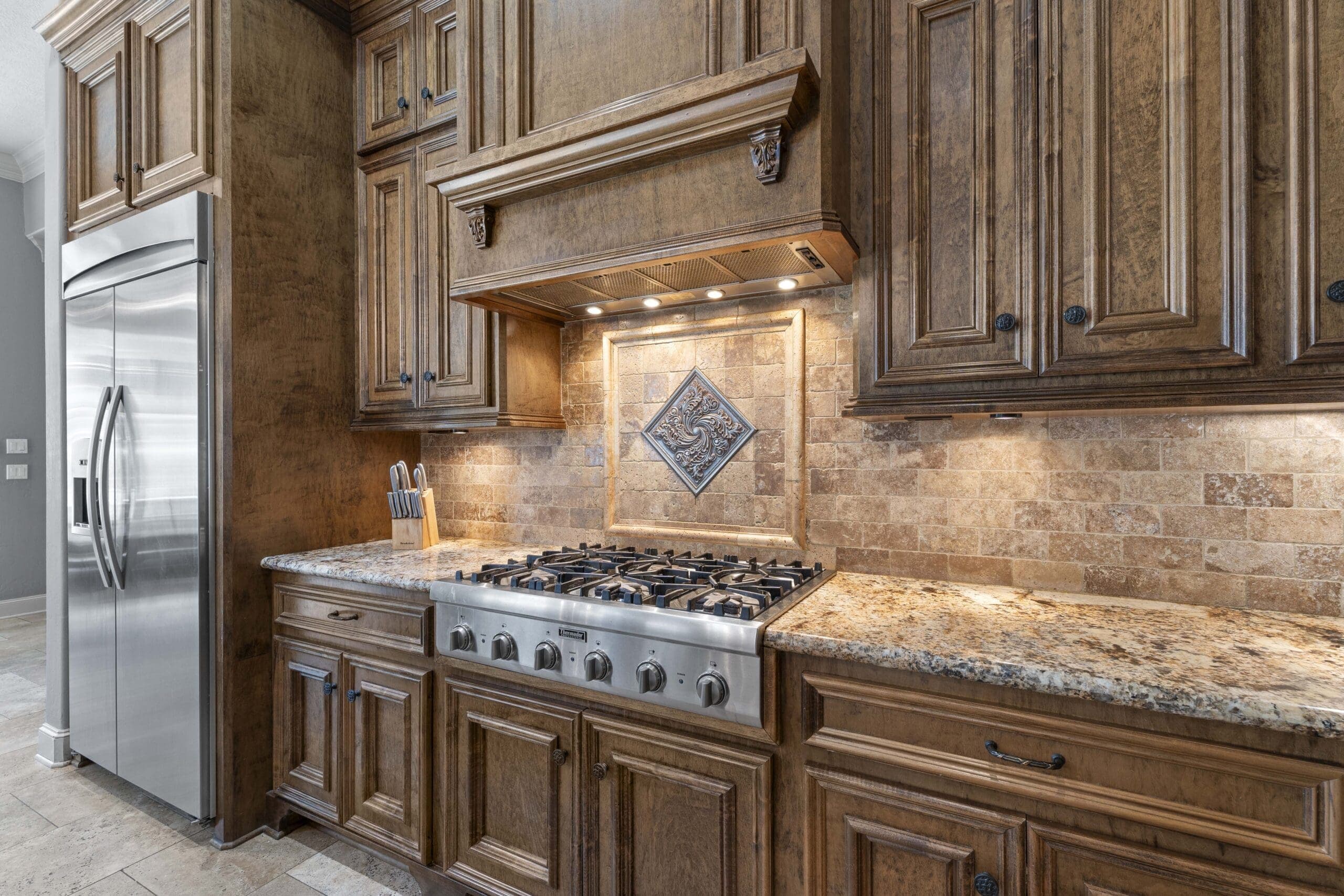 Professional real estate photography of a bright luxury kitchen for a Spring, Texas listing